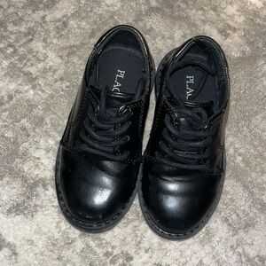 Little boy’s black dress shoes